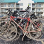 The muddy bikes ready to go home to get hosed off.